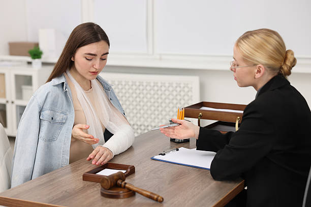 An accident attorney reviewing a vehicle collision file at a quiet desk