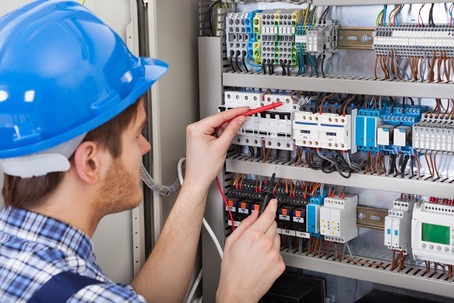 Electrician St Ives reviewing electrical building codes and permits for a North Shore home