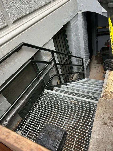 Iron works contractor in Park Slope Brooklyn NY — custom steel railing installed on historic brownstone stoop