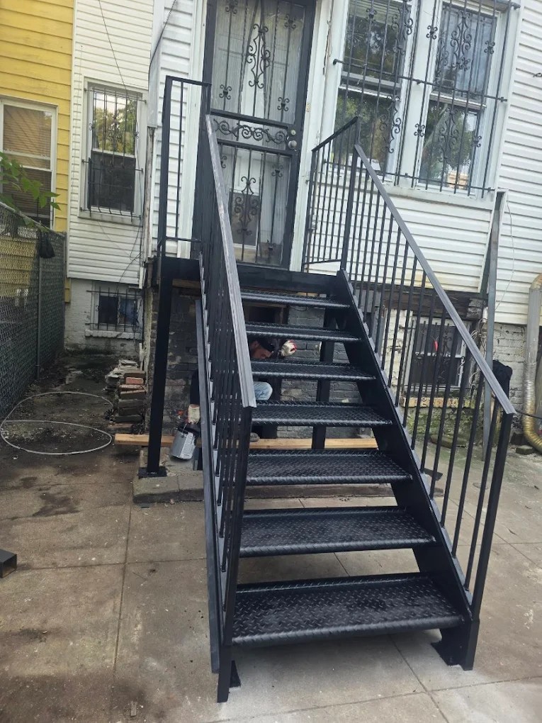 Custom steel staircase installation by Steel Masters NYC in Brooklyn neighborhood